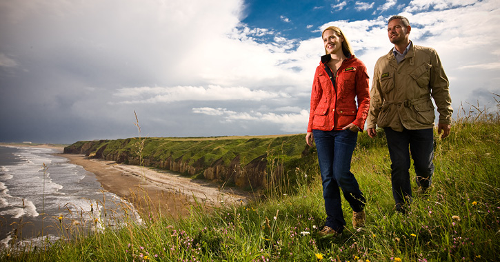 A couple walking on the Durham Heritage Coastal footpath